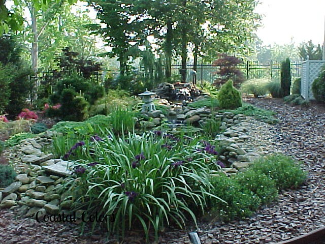 water feature pond waterfall, curb appeal, decks, landscape, outdoor living, patio, ponds water features, porches, In 1998 we added a pond to our landscape This photo was taken a year later I m so sorry for the poor quality of the photo it was made with an older digital camera