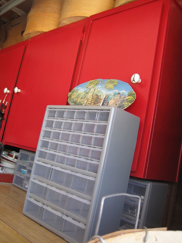 my creative space where this blogger creates, craft rooms, storage ideas, Old kitchen cabinets that the previous owner installed in his garage got a new paint job in girlie RED in my wearhouse this is one of my inspiration colours