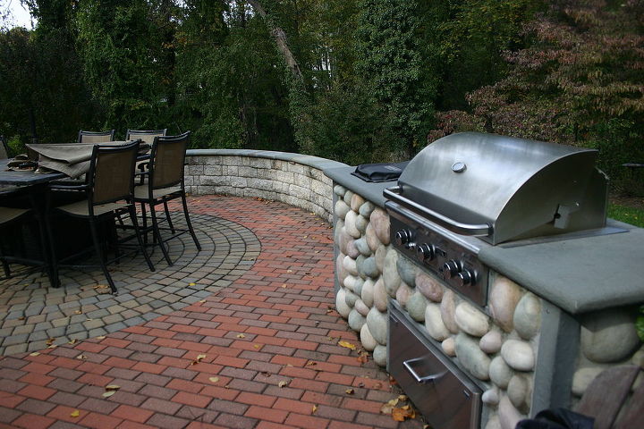 pond and patio, outdoor living, patio, The circle pattern is repeated in the wall radius and the wall with heat treated flagstone cap provides for additional setting for those larger parties