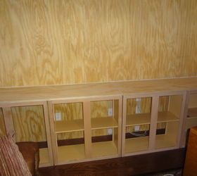 custom built entertainment center, Unfinished cabinets added
