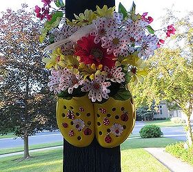 repurposing purses boots and crocs into fun decor, flowers, gardening, repurposing upcycling, Glued the Crocs together and embellished with silk flowers Hung on my Porch