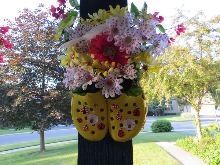 repurposing purses boots and crocs into fun decor, flowers, gardening, repurposing upcycling, Glued the Crocs together and embellished with silk flowers Hung on my Porch