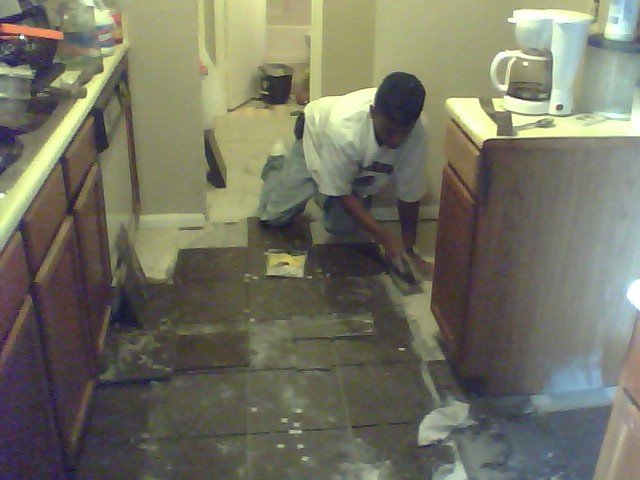 kitchen flooring, flooring, tile flooring, isn t my brother in law the greatest working steady and getting it done