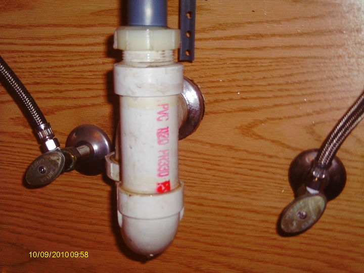 replacing a bathroom faucet, I disconnected the tw large plastic nuts and dropped the drain pipe out to install the new one Removing the flange was the most difficult WD40 was needed to unscrew the flange from the drainpipe