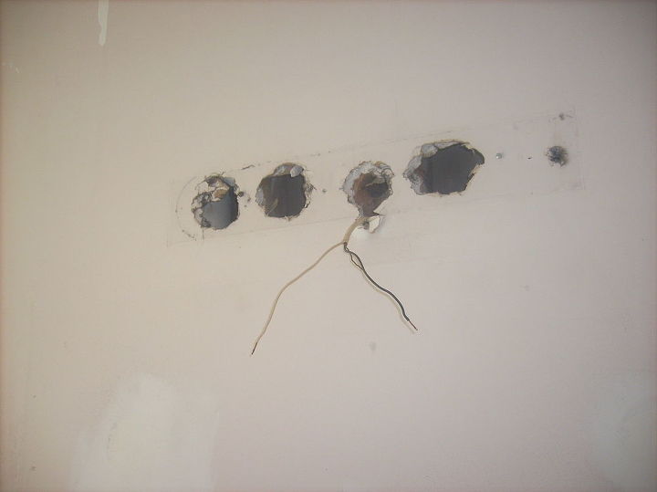 master bathroom, holes in the wall where the old light was