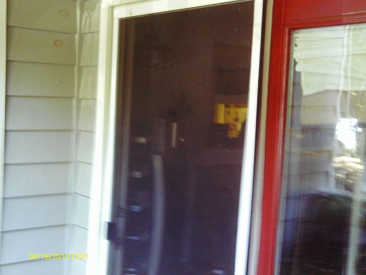 sliding screen door screen replacement and adjustment, The finished product is a nice fresh breeze coming through my place without bugs Plus my cat can now watch birds in the yard and cannot knock the screen out because it is properly adjusted Good job