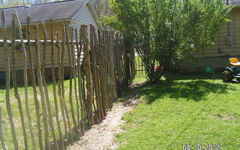 Repurposed trees my son cut and made a fence for the backyard.