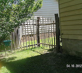 repurposed trees my son cut and made a fence for the backyard, concrete masonry, fences, outdoor living