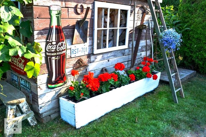 a happy grapevine accident story worth telling, garages, gardening, outdoor living, repurposing upcycling, In other news the red geraniums are doing awesome A little Miracle Grow brought the blooms right back to life in the old crate flowerbox