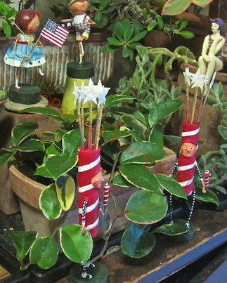 fourth of july in my succulent indoor garden, flowers, gardening, patriotic decor ideas, seasonal holiday d cor, succulents, urban living, You may recognize the newspaper boy alongside a flag waving girl in this image as they can be seen in image one accompanying this post More Details