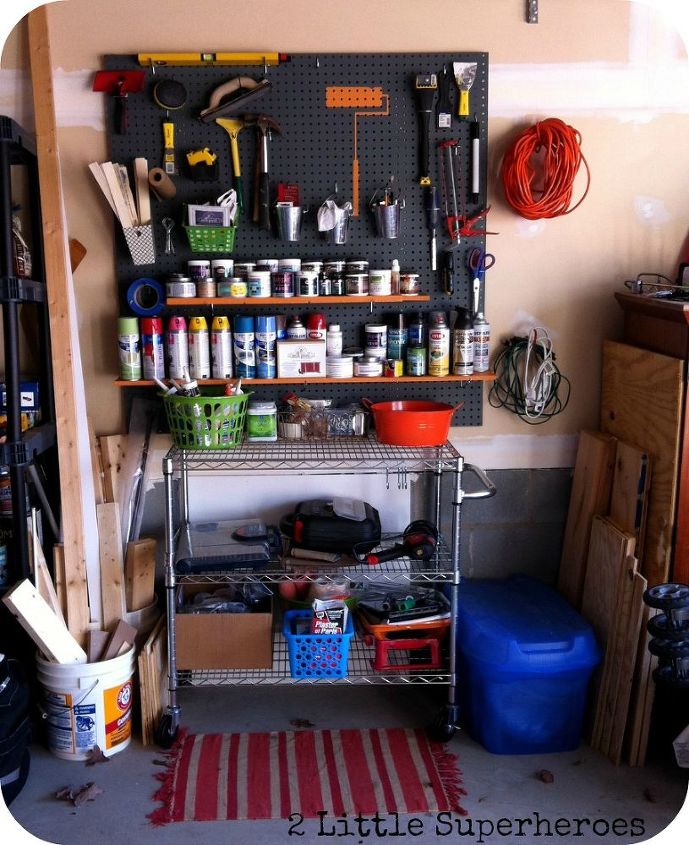 garage paint storage, cleaning tips, garages, shelving ideas, storage ideas, All my scrap wood pieces are stored in buckets to the side And painting tarps are now stored in the blue Rubbermaid bin to the side