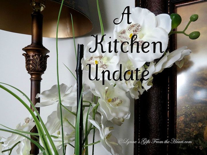 a small kitchen make over, home decor, kitchen design, Orchids to soften the metal lampshade