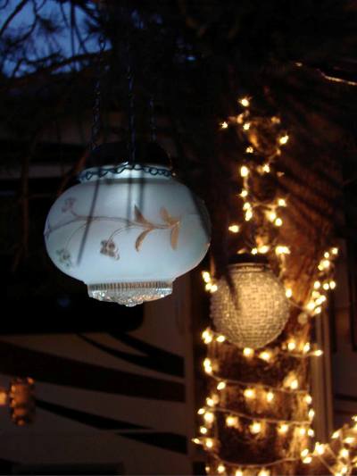 sensational recycled solar lights in the garden, outdoor living, repurposing upcycling, Find globes in thrift shops and flea markets hang with chain and pop in a solar light