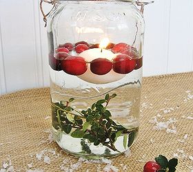 fun and easy christmas mason jar candles, christmas decorations, seasonal holiday decor, For this version you will need a floating candle fresh cranberries and some sprigs of boxwood I tied the boxwood to a nut to hold it at the bottom of the Mason jar Then simply add water a floating candle and fresh cranberries