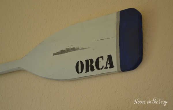 create a beach theme bedroom, bedroom ideas, home decor, This oar was hand painted with some stripes and stenciled with ORCA to give a very nautical feel to the space