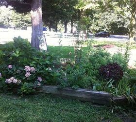 q volunteer landscaper needs ideas to finish work to ride project stuck, container gardening, flowers, gardening, landscape, perennial, The very first photo how it looked when all done Survived the winter and gorgeous now