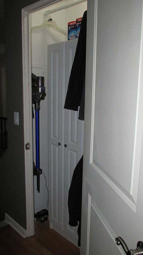 behind closet doors hidden conveniences, cleaning tips, closet, Hallway Closet Hidden Handheld Vacuum and Electric Blower Battery Pack