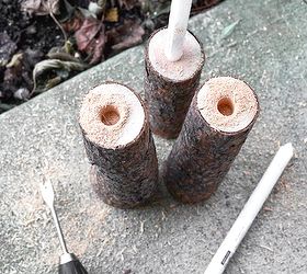 from firewood to christmas log candle centrepiece, christmas decorations, repurposing upcycling, seasonal holiday decor, Using a spade drill holes were drilled into the logs with a cordless drill Tip if your drill isn t quite large enough rock the blade Worked great