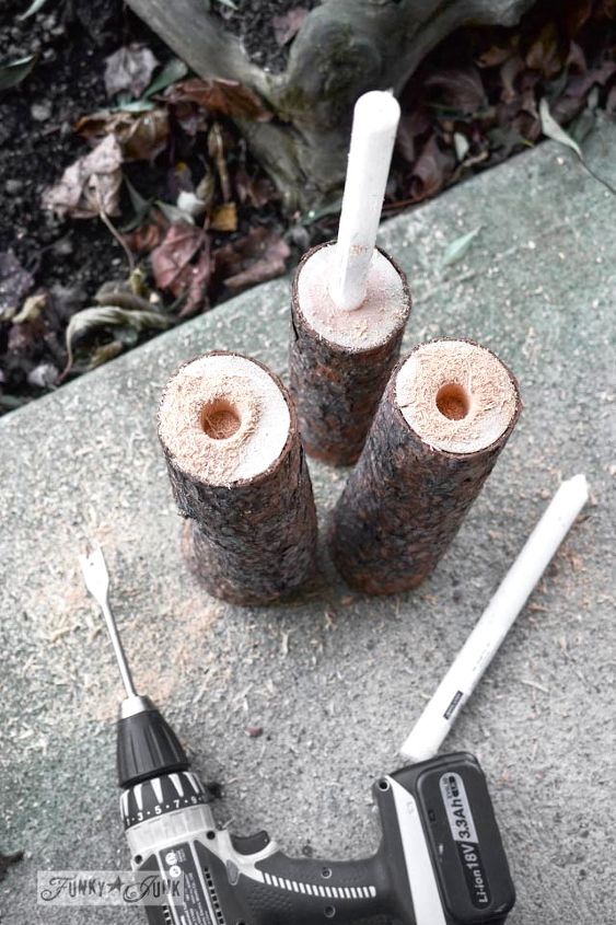 from firewood to christmas log candle centrepiece, christmas decorations, repurposing upcycling, seasonal holiday decor, Using a spade drill holes were drilled into the logs with a cordless drill Tip if your drill isn t quite large enough rock the blade Worked great