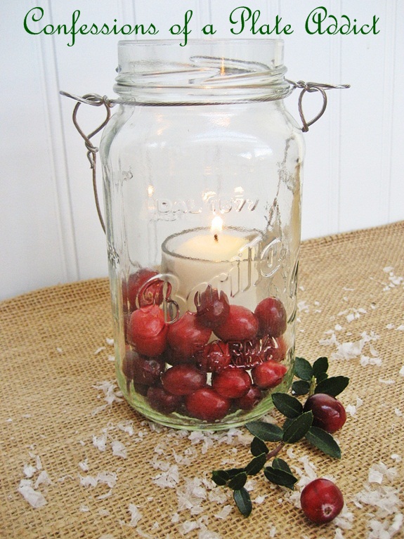 fun and easy christmas mason jar candles, christmas decorations, seasonal holiday decor, In this festive but simple version just place a votive candle and glass votive holder inside a Mason jar and surround the outer portion with fresh cranberries