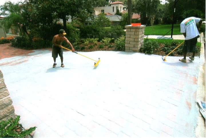 pavers retaining walls landscaping and lighting, concrete masonry, curb appeal, gardening, home improvement, landscape, stairs, Polymeric sand being installed this will give the pavers a grouted finish