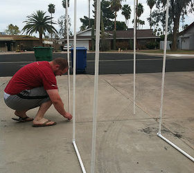 easy diy pvc water fun for the kids, outdoor living, My husband putting together the pvc