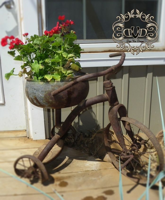flower pots from junk, container gardening, flowers, gardening, repurposing upcycling, Here I took my husband s childhood tricycle that the bus hit and knocked the seat off of By replacing the seat with a metal bowl I found the opportunity to bring this baby to the forefront each season