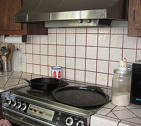 a galley kitchen makeover, home decor, kitchen backsplash, kitchen design, Before The 70 s contrasting tile and grout were in need of an update I was surprised to find the owner wasn t joking when she said if you touch the range hood and the range at the same time You ll get zapped She was right
