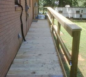 this is one ramp built by our brotherhood for one of our elder members, curb appeal, diy, woodworking projects, House side is bolted to the brick with 1 2 redhead anchors and the posts are 24 in the ground with concrete around them