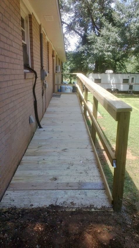 this is one ramp built by our brotherhood for one of our elder members, curb appeal, diy, woodworking projects, House side is bolted to the brick with 1 2 redhead anchors and the posts are 24 in the ground with concrete around them
