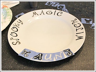 halloween party table, crafts, halloween decorations, painting, seasonal holiday decor, DIY Halloween plates with stencils and porcelain paint For complete instructions on any of my DIY Halloween projects stop by my website