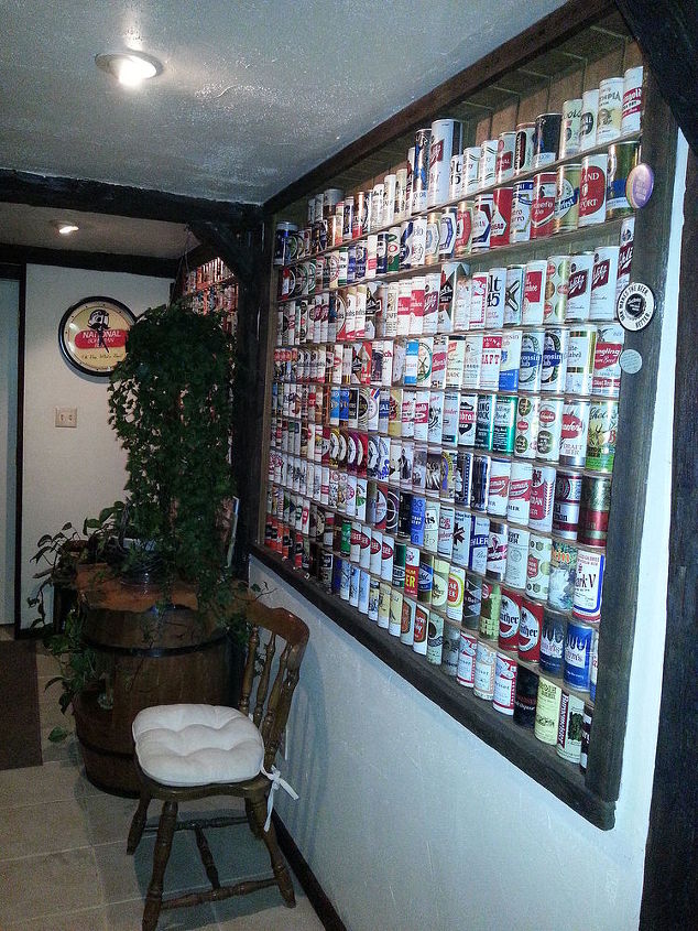 basement remodeling, basement ideas, diy, home improvement, A wall of old beer cans from around the world covers one side of the bar room