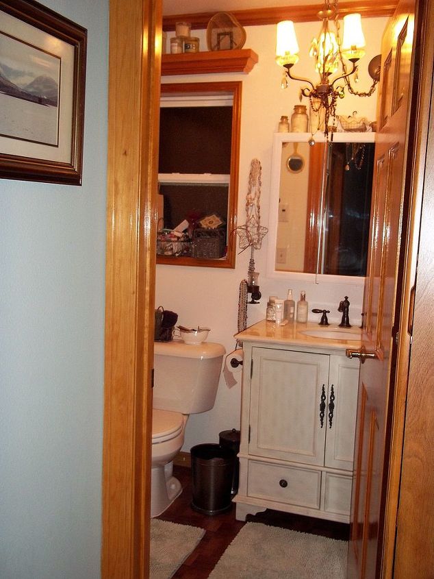 my bathroom mini redo, cleaning tips, home decor, Vanity with painted medicine cabinet and chandilier Taken from hallway
