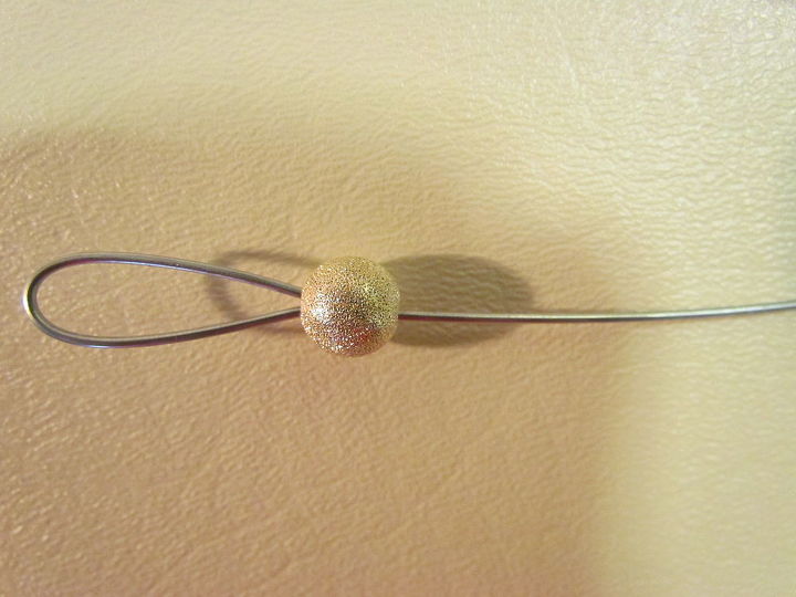 candle snuffer with dingle dangle bling, String on a large hole bead to cover both the cut end of the wire and the handle end of wire
