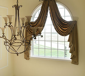 arched window drapes crowning glory 1 designer s secrets, home decor, reupholster, window treatments, windows, Arched window treatments are designed to bring together the elements in the entry such as classic and elegant chandelier that works beautifully with the drapery medallion