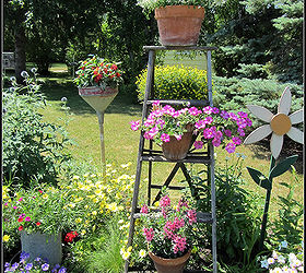 my proudest diy moment 20 years in the making, flowers, gardening, perennials, Decorating the border with signs a stepladder a funnel a wooden daisy birdhouses Enjoy your garden