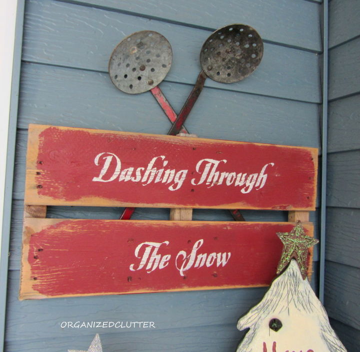 a christmas pew for the patio, christmas decorations, seasonal holiday decor, wreaths, I continued my red theme with the Dashing Through The Snow pallet sign and two vintage Ice fishing dippers