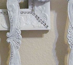 wall gallery for small wall 5 of 5 white and silver d cor accents, crafts, decoupage, home decor, paint colors, wall decor, This small frame was really beat up I painted and distress it to try and cover up those spots and used silver glitter Hot glued rhinestone trim on the other