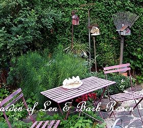 a trip down memory lane my former garden, flowers, gardening, outdoor living, patio, Bluestone patio and birdhouses hung on vintage rakes