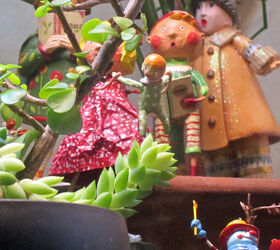 christmas decor using a cast of characters part one, christmas decorations, seasonal holiday decor, A scene from 2011 where both Ms Golden Jacket and one of the Tam Twins hide behind the cacti in my succulent garden