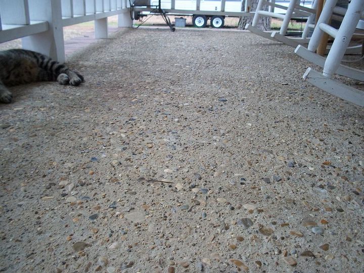 q i m in need of ideas suggestions on redoing surface of my porch, concrete masonry, curb appeal, porches, Very rocky some with sharp edges What was whoever did this thinking