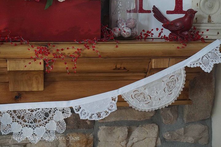 create an easy and fun doily banner, crafts, fireplaces mantels, seasonal holiday decor, valentines day ideas, 3 Neatly apply fabric glue to hold in place I used Elmers school glue When dry I sewed along the seam binding for security