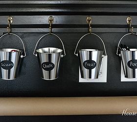 how to make a chalkboard wall in your home office craft room, A shelf holds pails with supplies like chalk and erasers while a curtain rod holds a roll of craft paper that I cut off to cover my craft table when working on a project