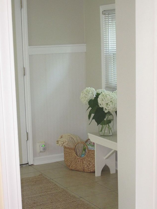 mudroom makeover using bead board wallpaper, diy, home decor, paint colors, wall decor, stepping down into the mudroom from the front room and looking to the right this is a picture of the small wall behind the door that goes to the garage