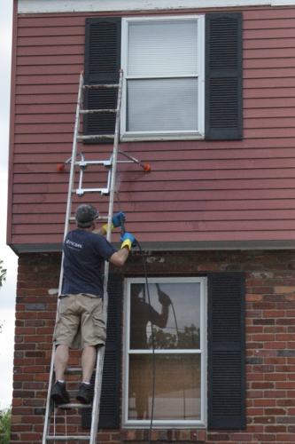 how we washed our aluminum siding, cleaning tips, curb appeal, With our gloves and eye protection on we first sprayed on the TSP solution moving from bottom to top