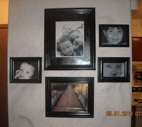 everything in black and white, home decor, wall decor, Wall of grand children I marble painted the wall behind the photos before my back injury