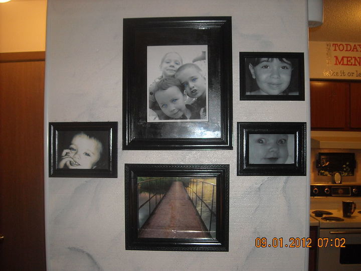 everything in black and white, home decor, wall decor, Wall of grand children I marble painted the wall behind the photos before my back injury