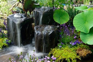 los paisajes acuaticos crean hermosos patios traseros, Put s Ponds Gardens en Chesterfield MI cre estas hermosas fuentes de basalto