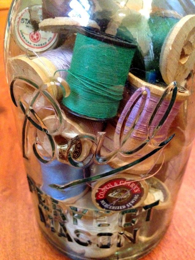 make diy mason jar lamps fun way to upcycle jars of buttons and more, crafts, lighting, mason jars, repurposing upcycling, Another lamp we made using old spools of thread in a glass Ball jar