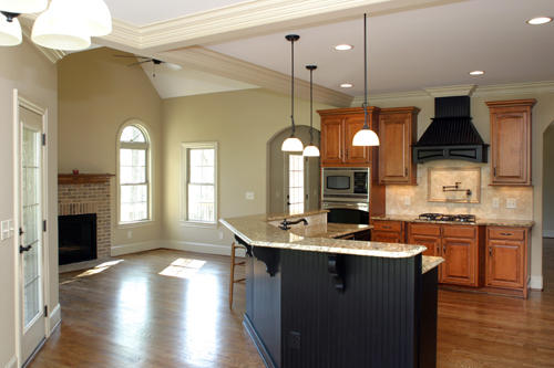 are keeping rooms a new kitchen trend, This new construction home by Triad Homes has a fantastic keeping room off the open kitchen